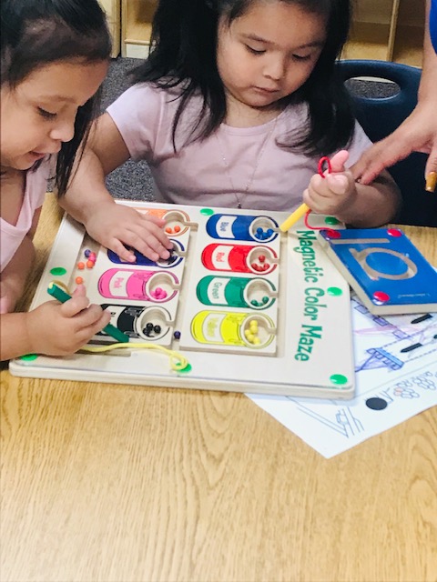Children engaged in play to learn activities